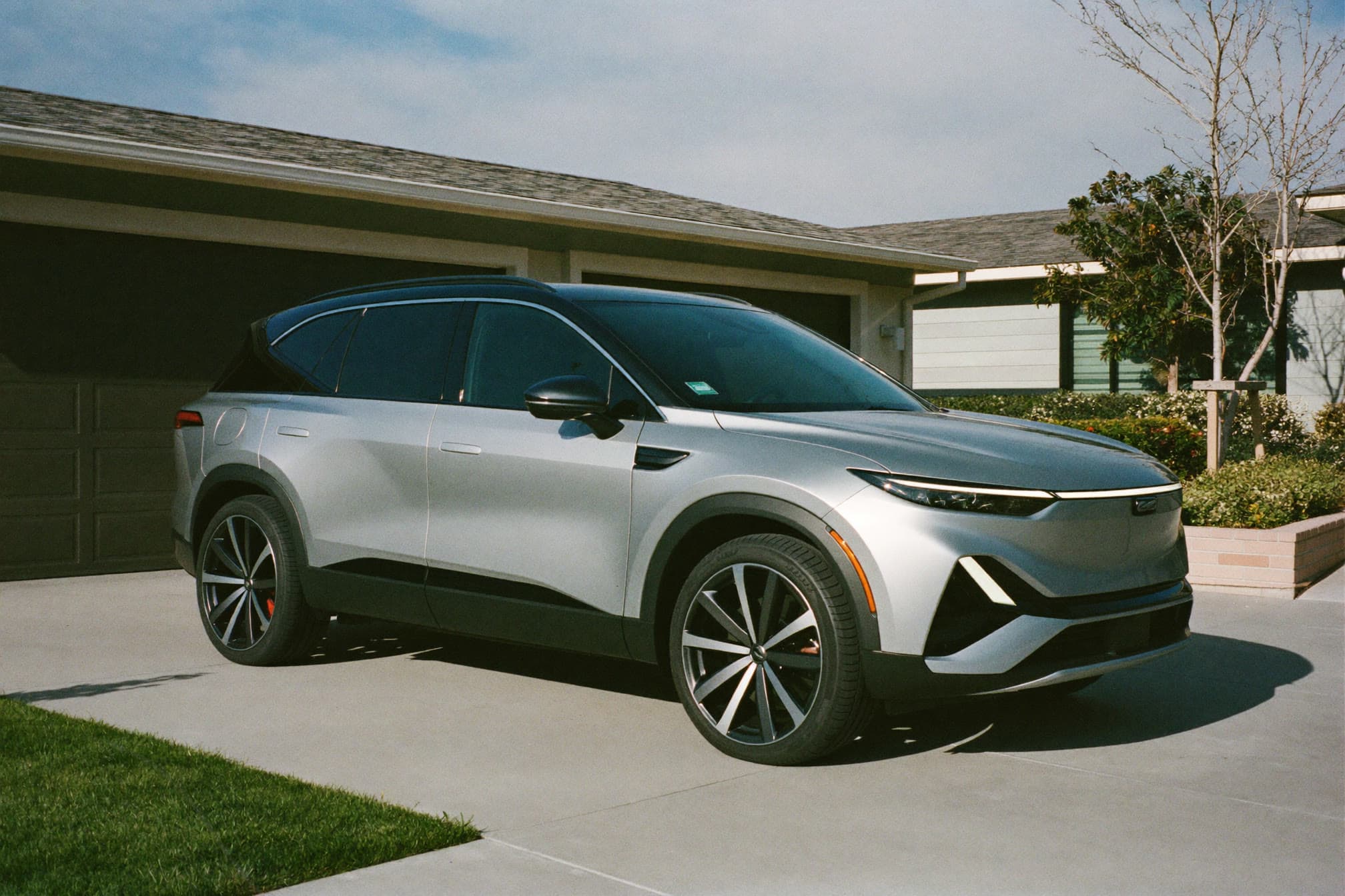 Sedan parked in a residential driveway