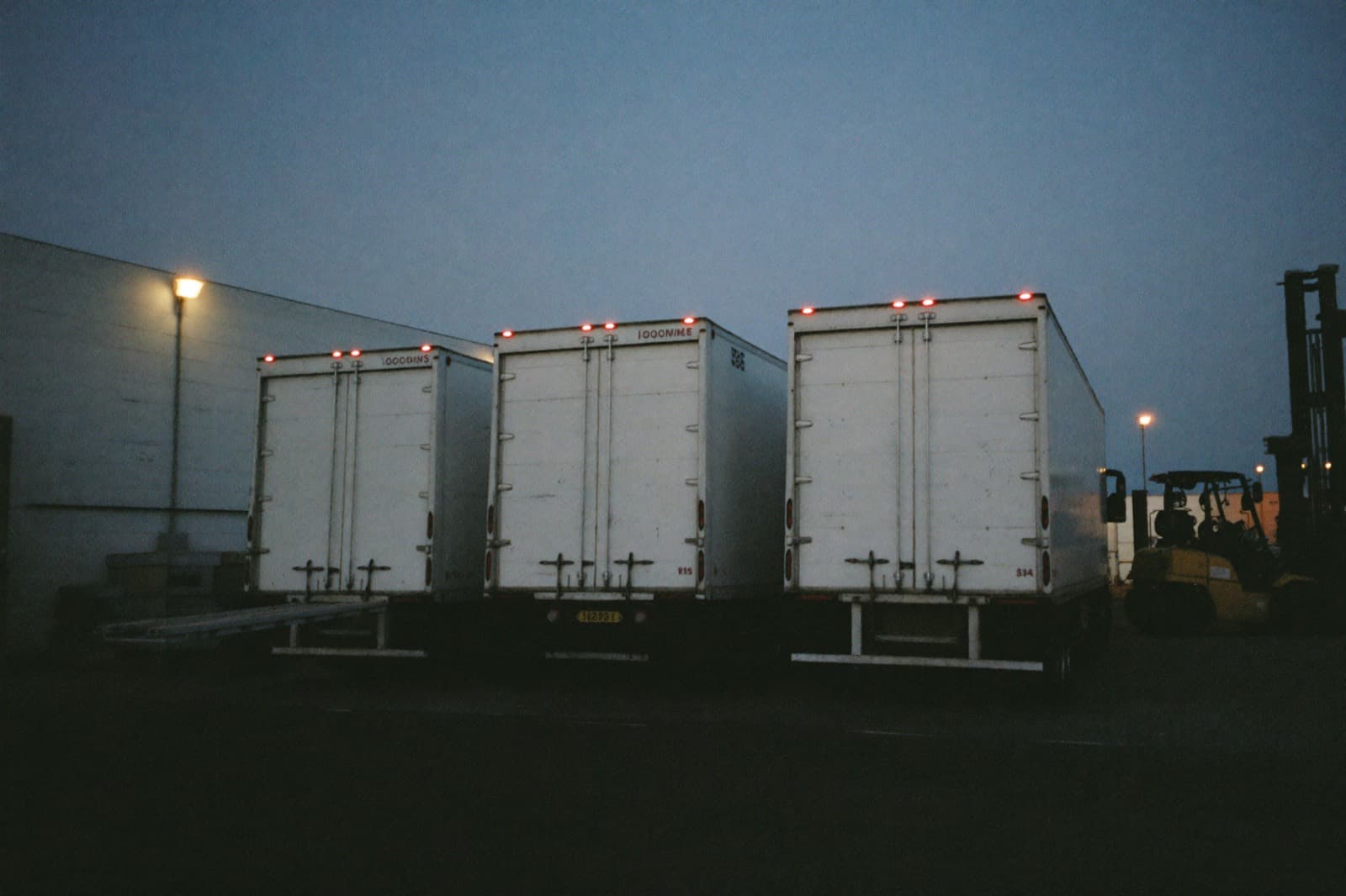 Commercial trucks lined up at a depot